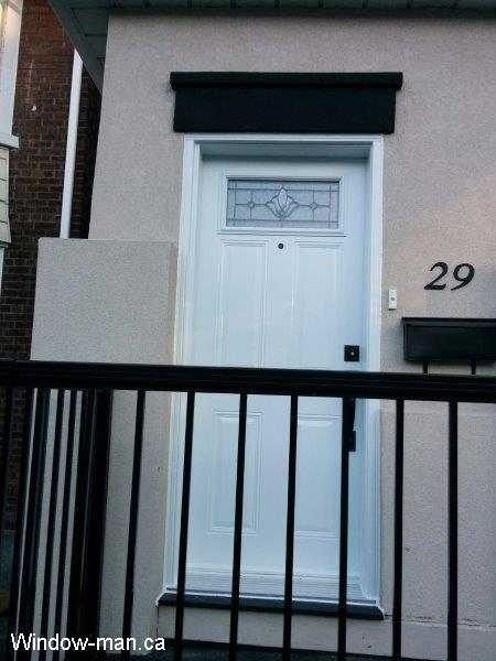 Single entry front door installation, stacco. White 6 panel top glass. Beveled Glass patina caming. Professional installation by independent contractor